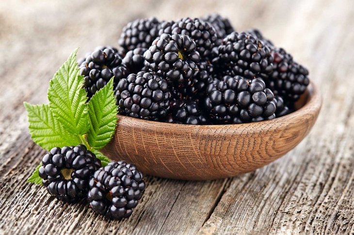Blackberry on a wooden background